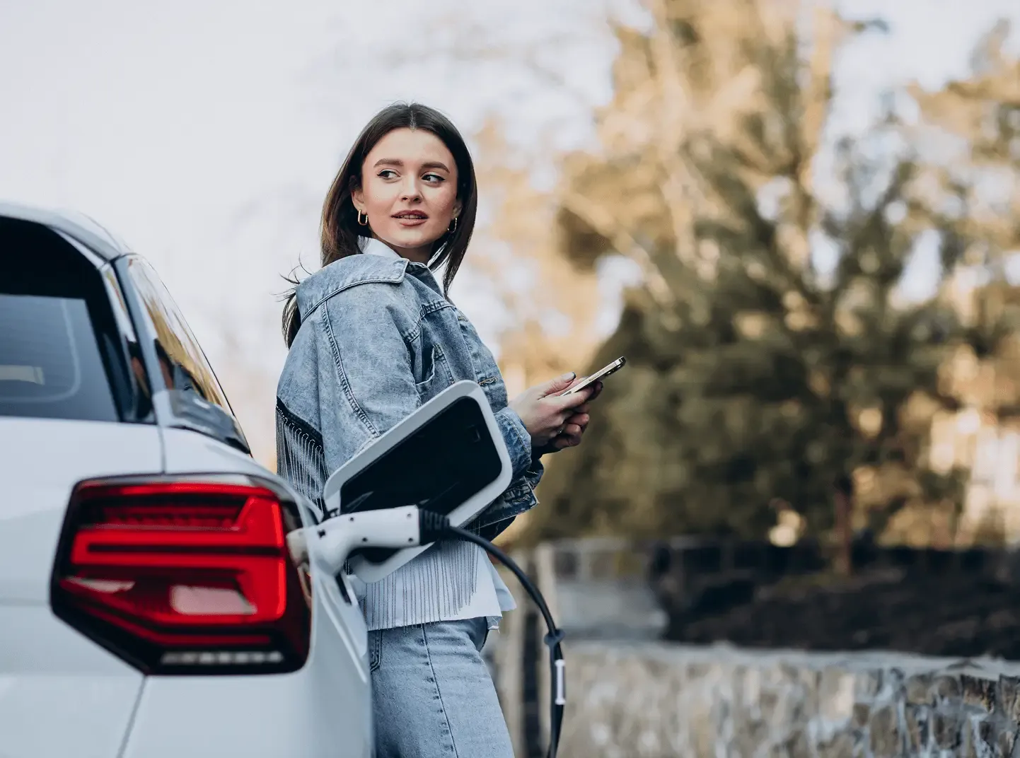woman-charging-her-electric-car-with-charging-pistol